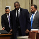R. Kelly (center) appears in court in Chicago May 7, 2019, on sex assault charges he faces. On May 30, 2019, prosecutors hit the singer with a whole new slate of sex abuse charges.